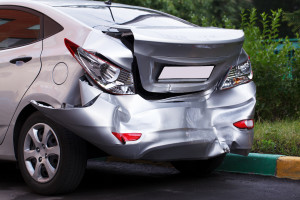 A car has a big dent after an accident